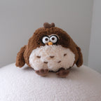 Dundun chicken shaped like a brown owl with black glasses